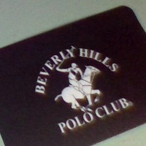 a wallet  with a quarter inside from bh polo club